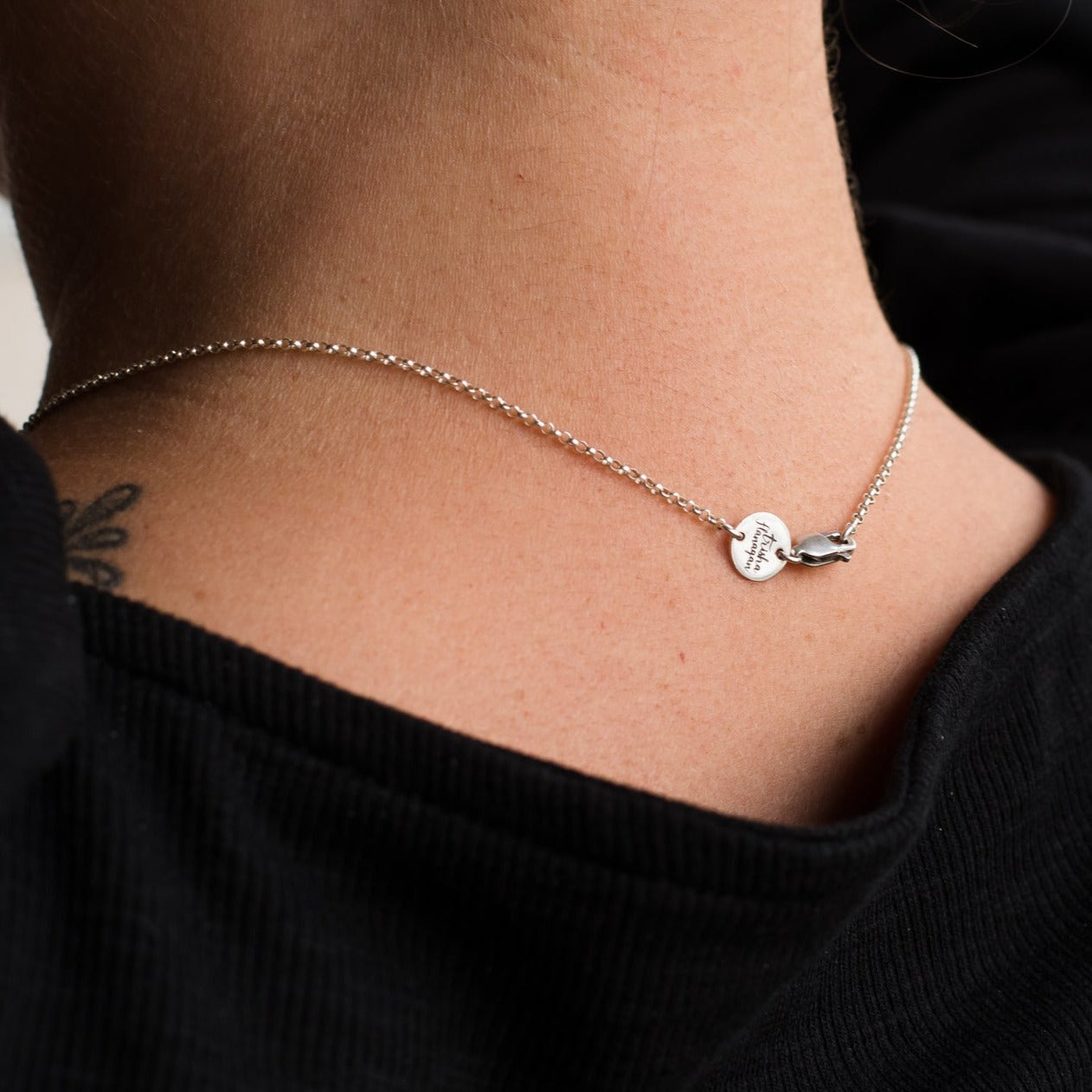 Back of Necklace with Trisha Flanagan logo tag