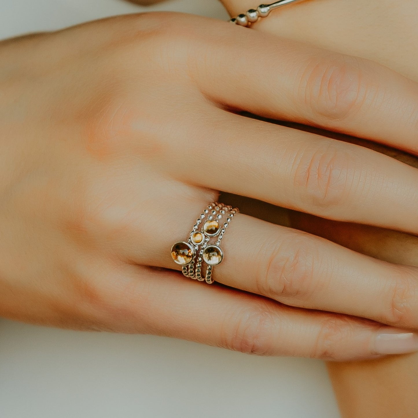 Woman wearing different size Citrine Silver Rings - Trisha Flanagan