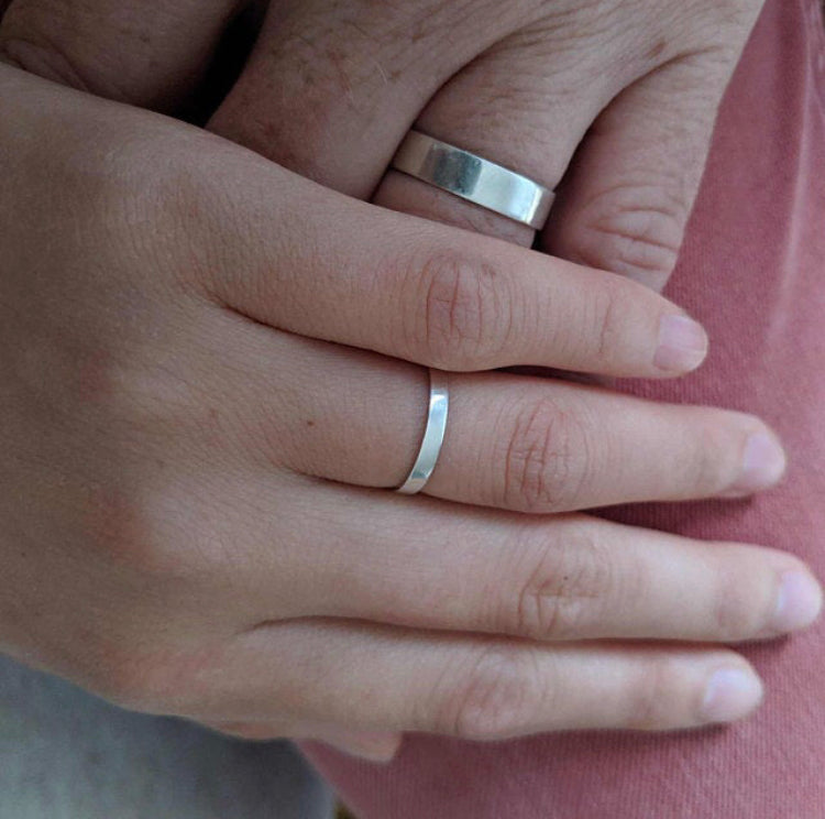 Man and Woman wearing different size Minimalist Silver Wedding Band - Trisha Flanagan