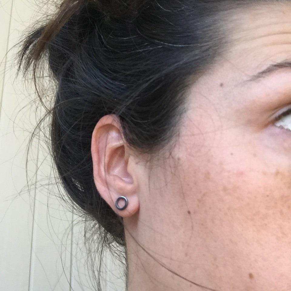 Woman wearing a Black Silver Open Circle Stud Earring - Trisha Flanagan