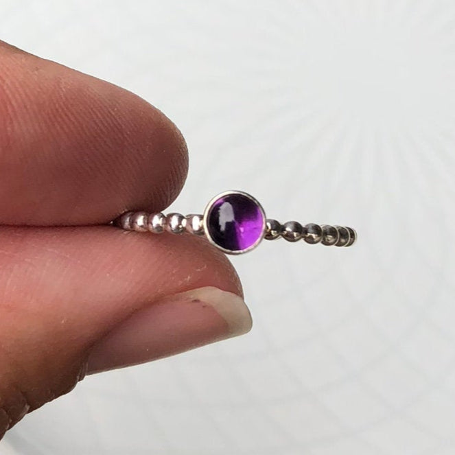 Woman holding a Small Amethyst Silver Ring - Trisha Flanagan