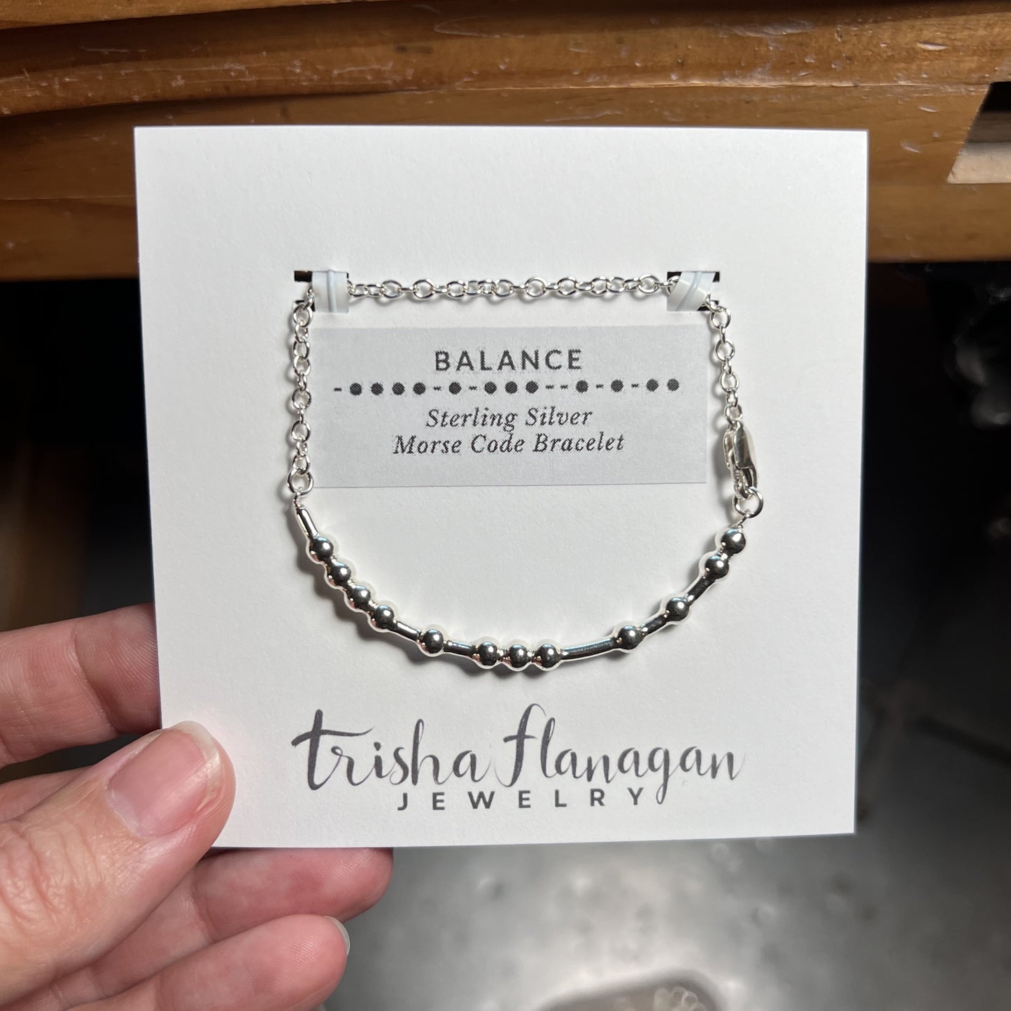 Balance Morse Code Chain Bracelet on a display card