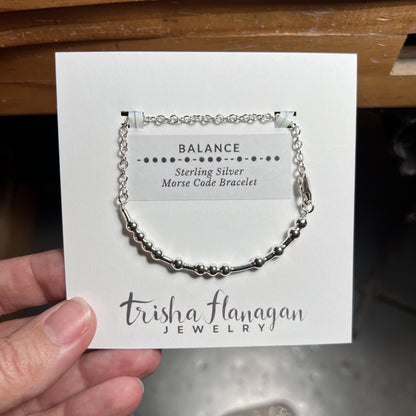 Balance Morse Code Chain Bracelet on a display card