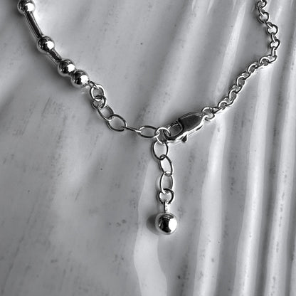 An inch extender chain with bauble charm