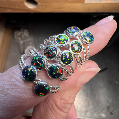 Holding all the Black Opal Rings