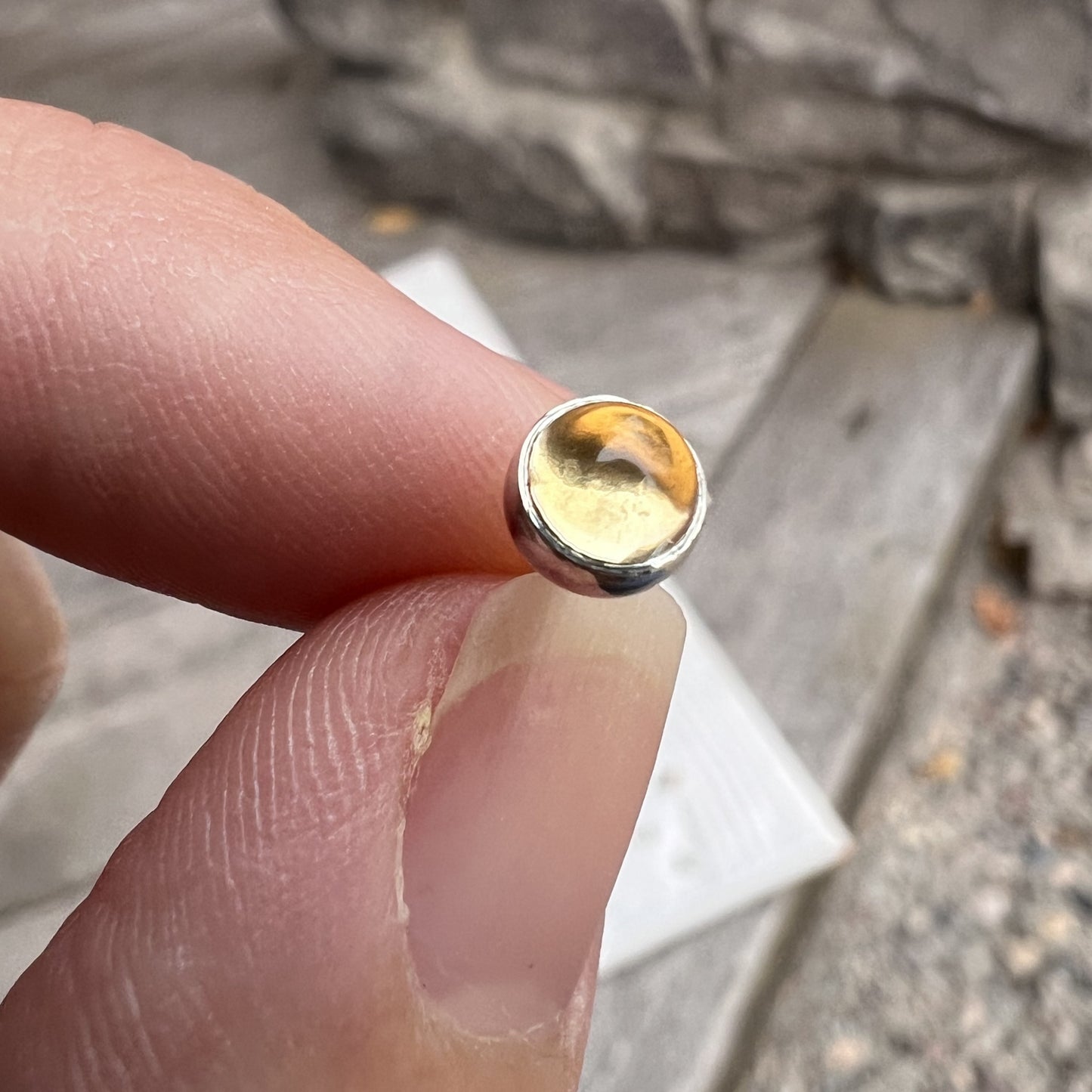 Holding Women's Citrine Stud Earrings in Silver