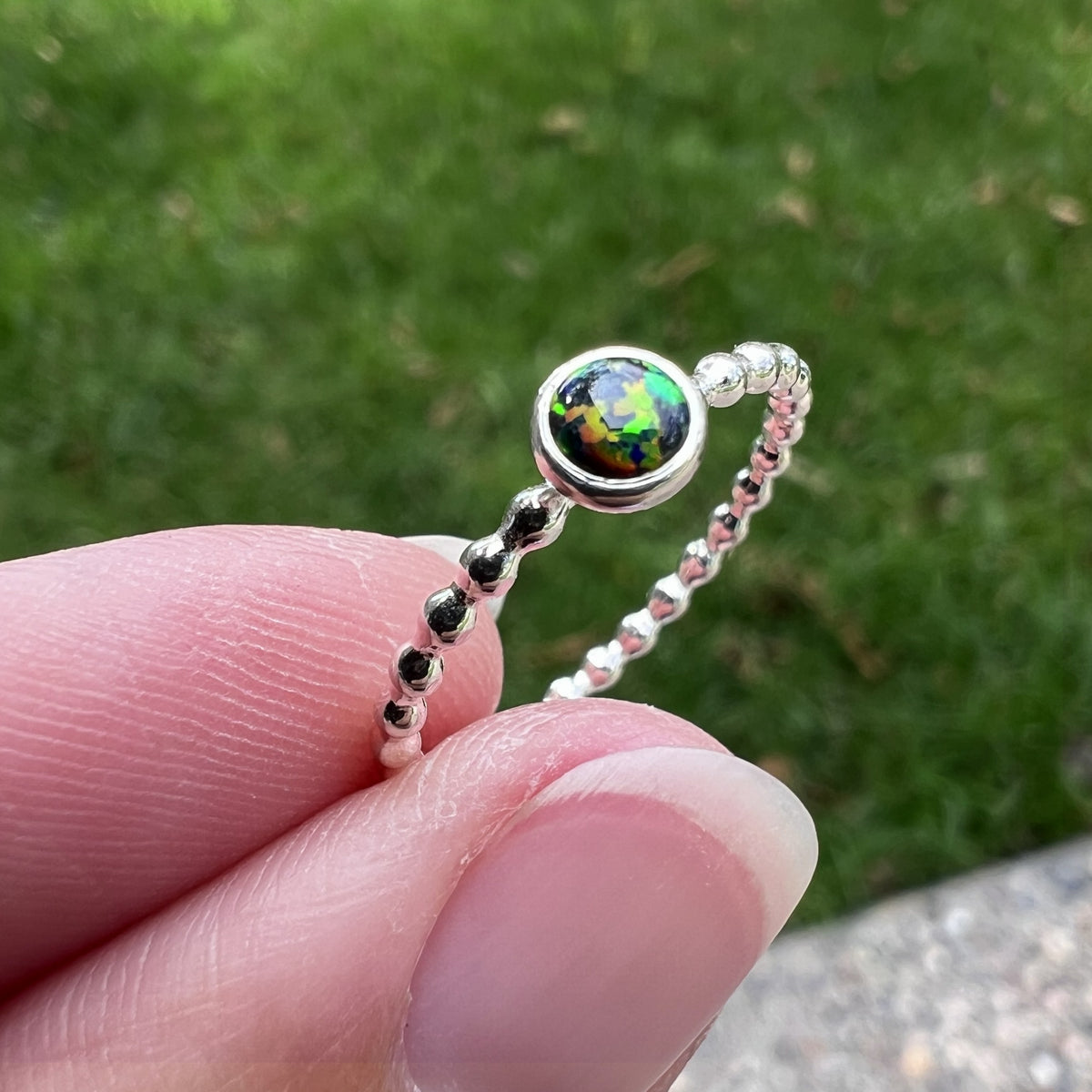 Holding a small Black Opal Ring