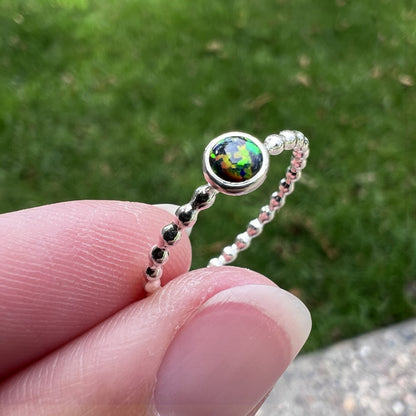 Holding a small Black Opal Ring