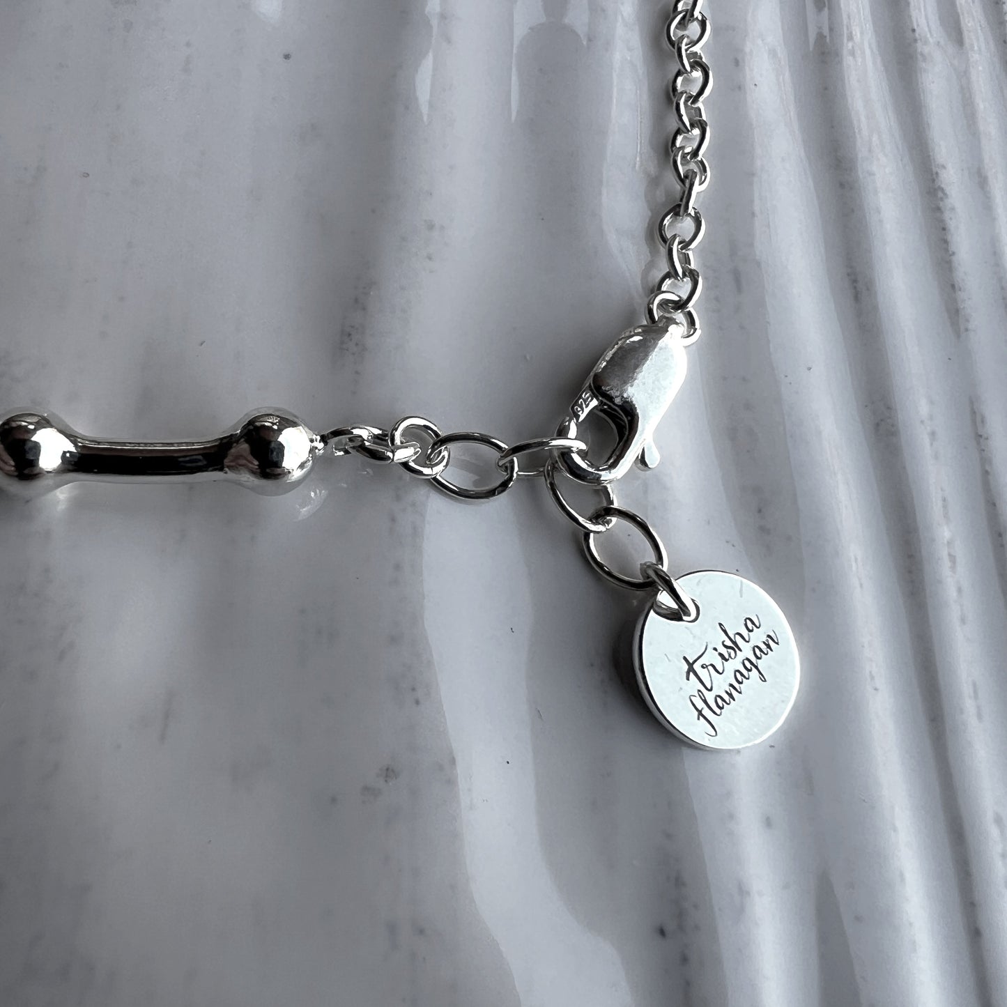 Half inch extender chain with logo charm