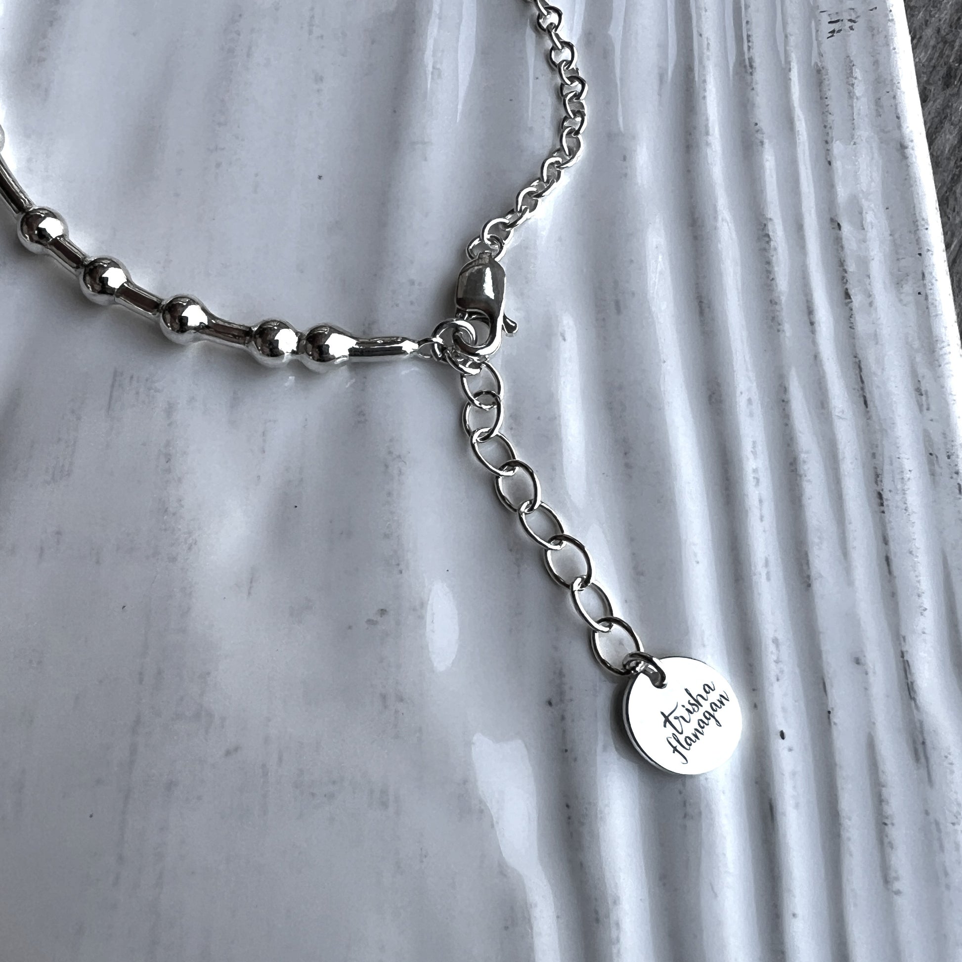 Inch extender chain with logo charm
