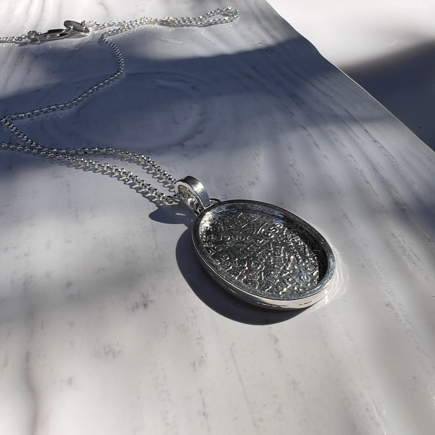 The Wordsmith Pendant side view