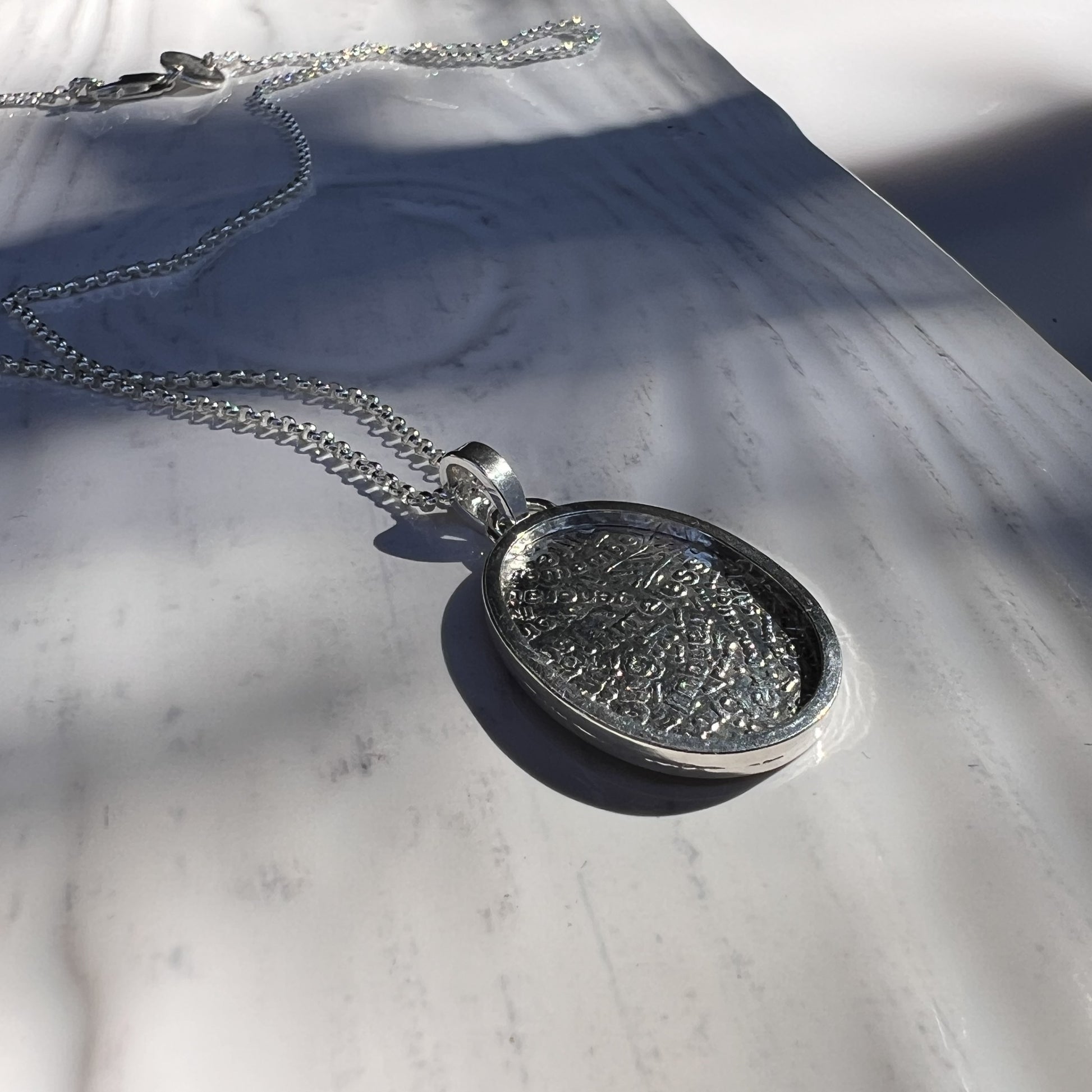 The Wordsmith Pendant side view