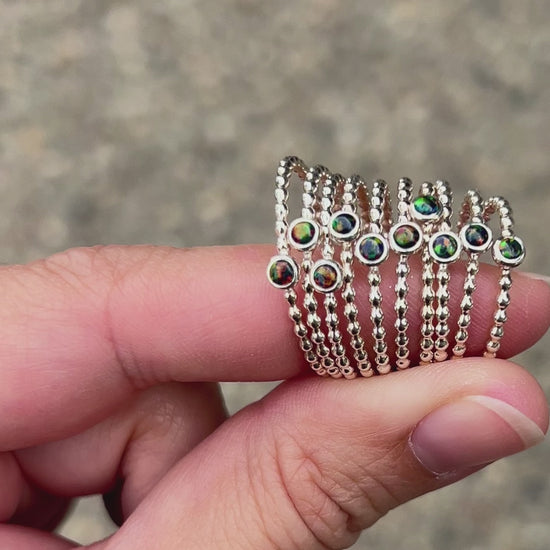 Holding 3mm Black Opal Stacking Rings