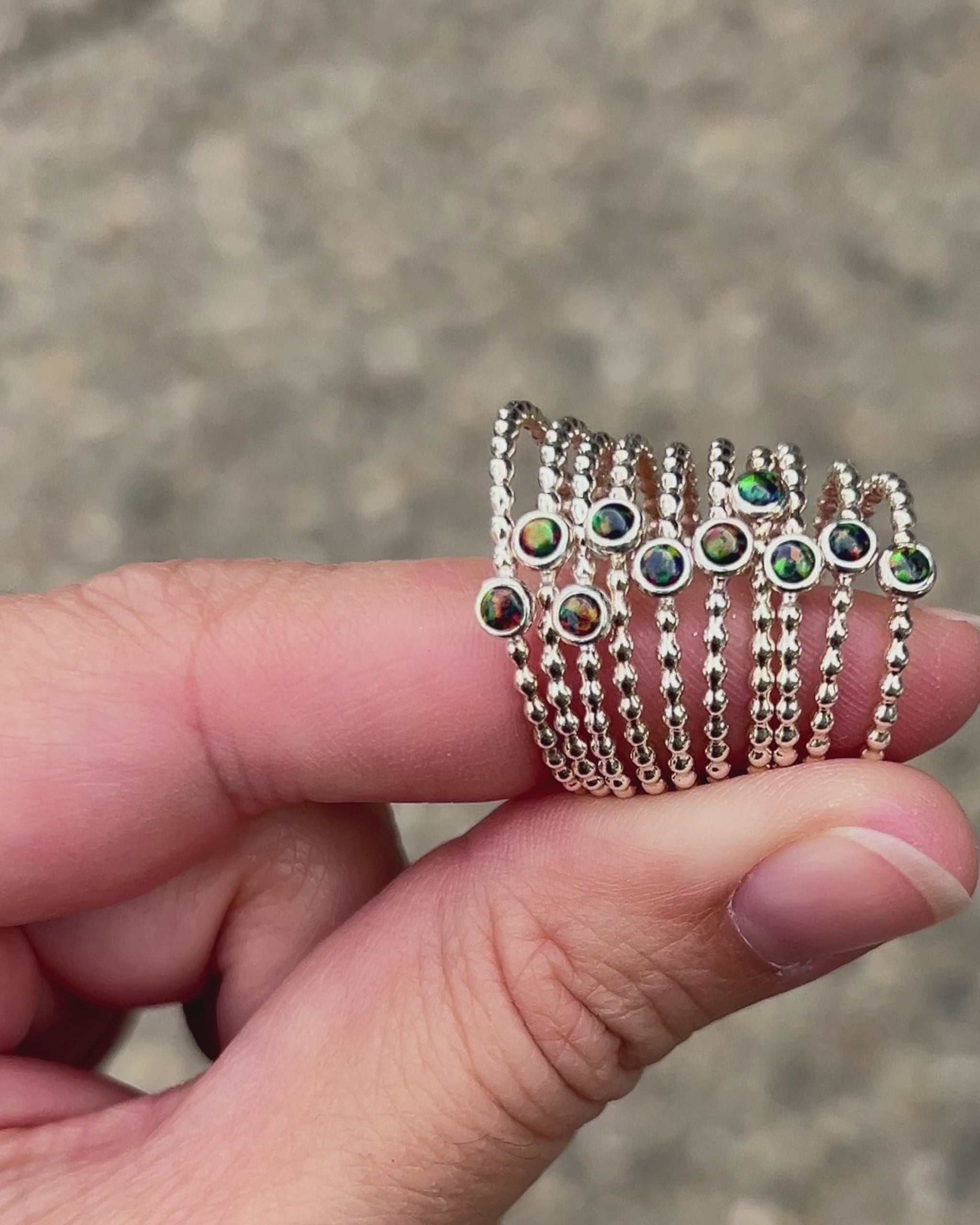Holding 3mm Black Opal Stacking Rings