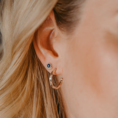 Woman wearing Sapphire Eyelash Stud Earrings with twisted hoops - Trisha Flanagan