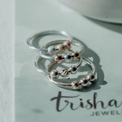 Several Fidget Rings stacked - Trisha Flanagan