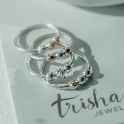 Several Fidget Rings stacked - Trisha Flanagan