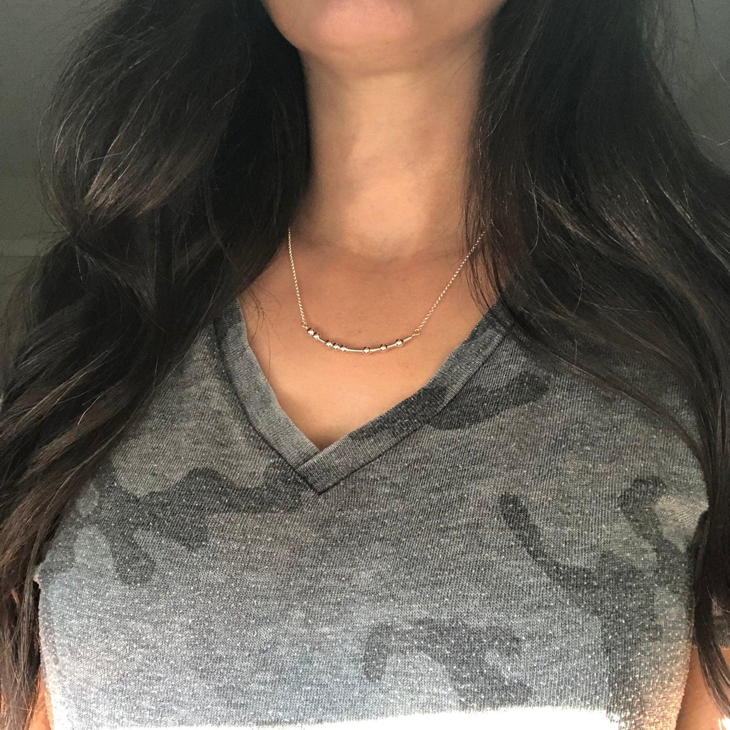Woman wearing FUCK Morse Code Necklace