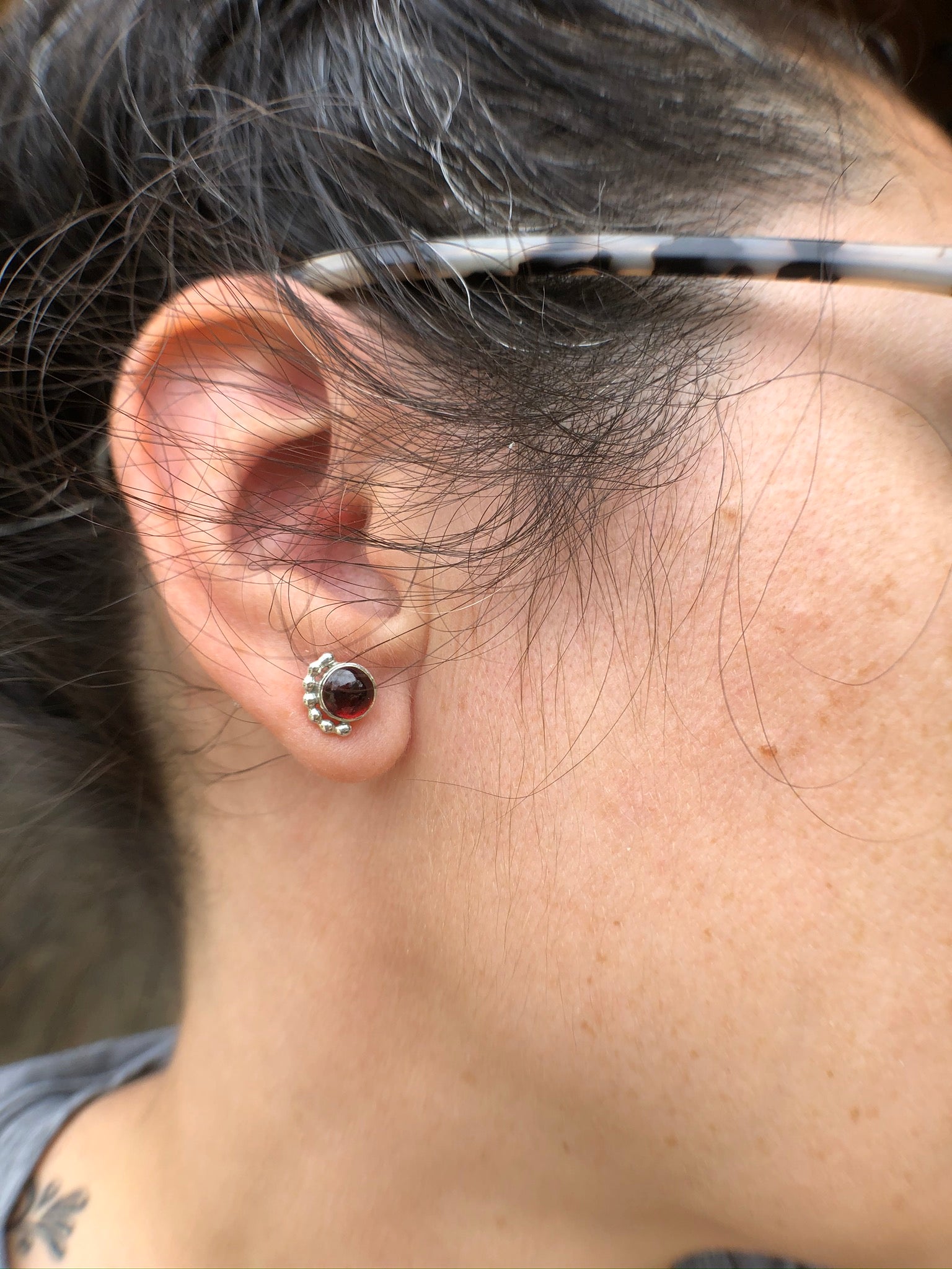 Woman wearing a Large Garnet Eyelash Stud Earring - Trisha Flanagan
