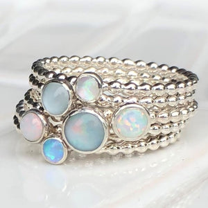 Different Manmade Simulated Opal and Genuine Opal Silver Rings stacked - Trisha Flanagan