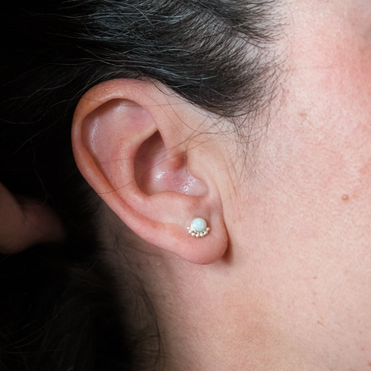 Woman wearing Gemstone Eyelash Stud Earrings close up - Trisha Flanagan