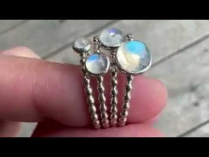 Video of the blue flashes of rainbow moonstone rings - Trisha Flanagan