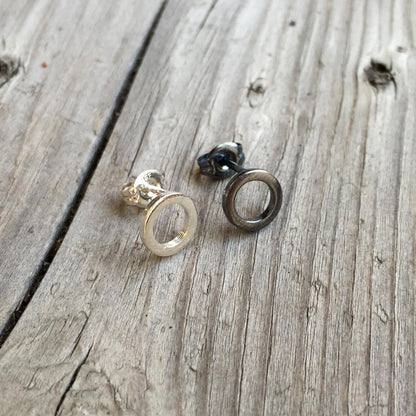 One Silver Open Circle Stud Earring and one Black Silver Open Circle Stud Earring - Trisha Flanagan