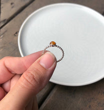 Load image into Gallery viewer, Woman holding a Medium Baltic Amber Silver Ring side view - Trisha Flanagan