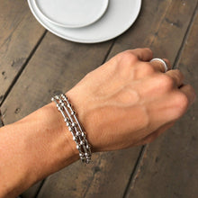 Load image into Gallery viewer, Woman wearing three silver Morse Code Bracelets