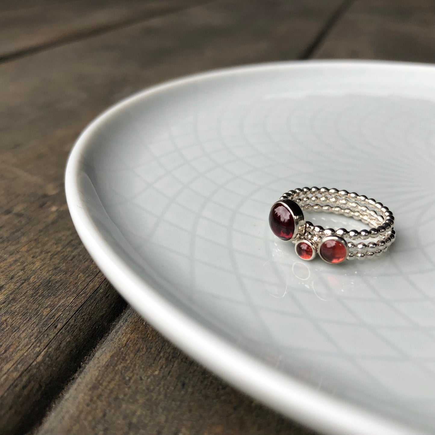 Different size Red Garnet Silver Rings stacked - Trisha Flanagan