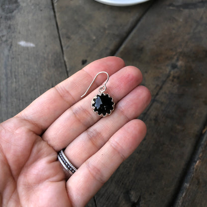 Woman holding a Black Onyx and Silver Dangle Earrings front view - Trisha Flanagan