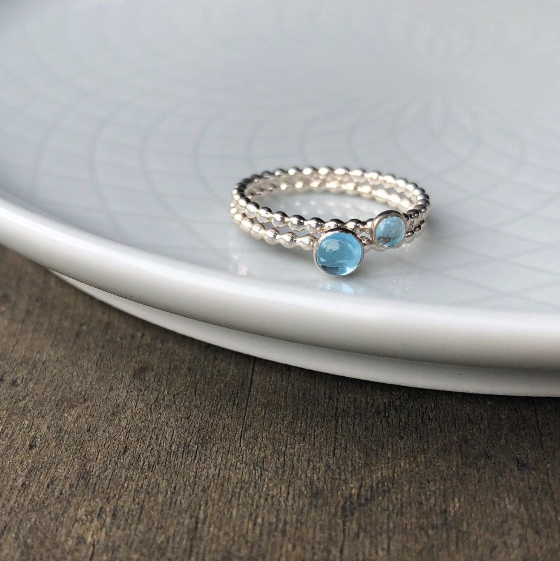 Different size Swiss Blue Topaz Rings stacked - Trisha Flanagan
