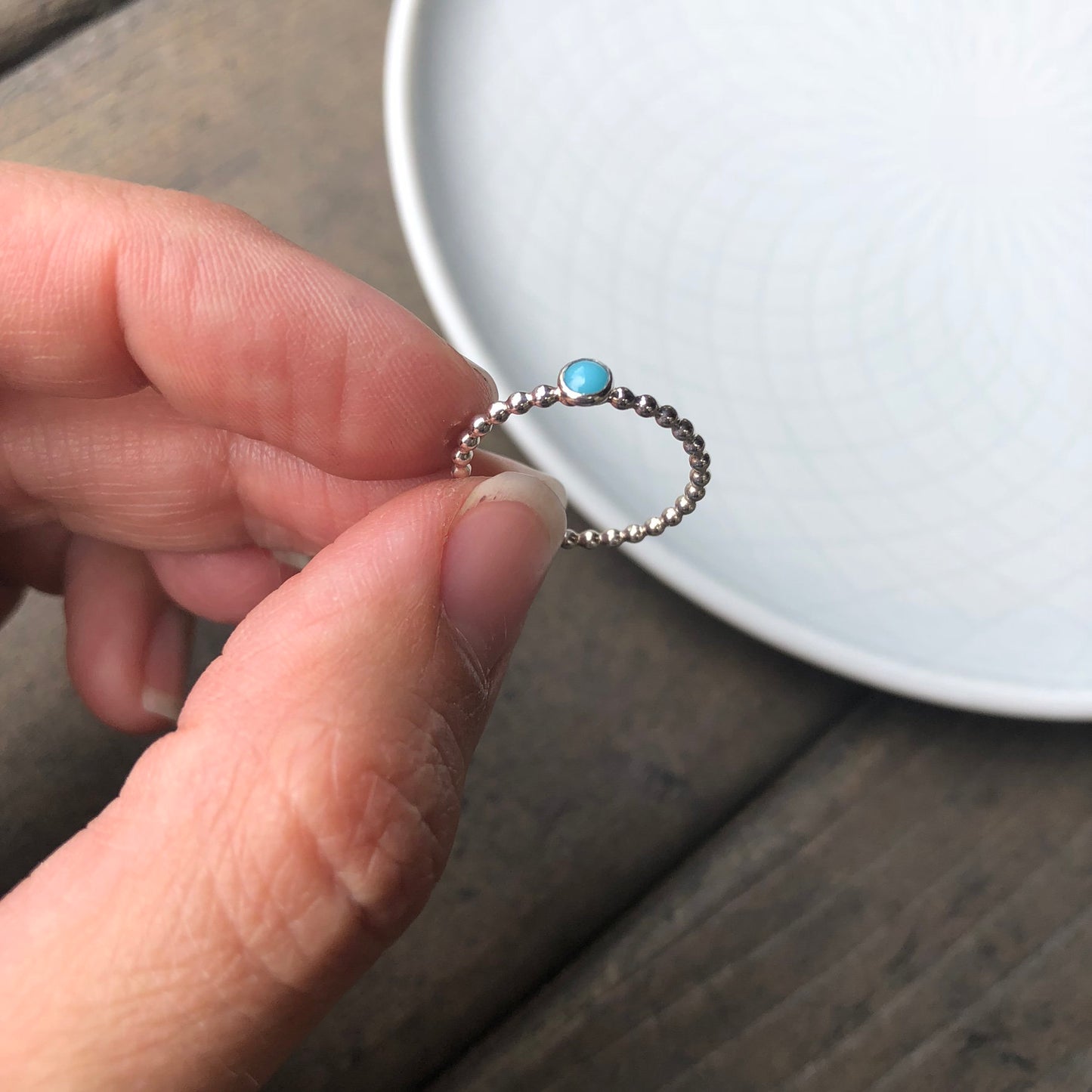 Woman holding a Mini Turquoise Sterling Silver Ring - Trisha Flanagan