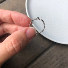 Load image into Gallery viewer, Woman holding a Mini Turquoise Sterling Silver Ring side view - Trisha Flanagan