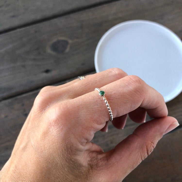 Woman wearing a Mini Emerald Silver Stacking Ring - Trisha Flanagan