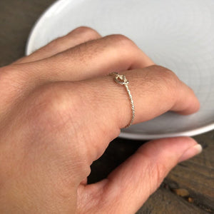 Woman wearing Textured Silver Knot Ring close up - Trisha Flanagan