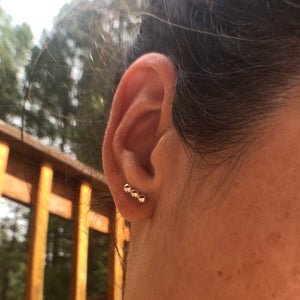 Woman wearing Sterling Silver Triple Dot Line Stud Earrings - Trisha Flanagan
