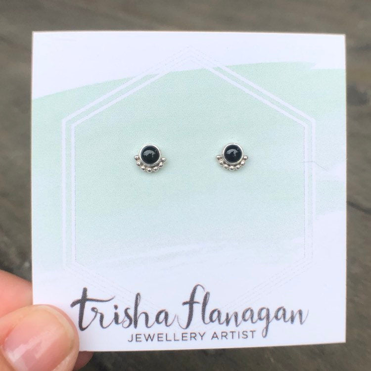 Onyx Eyelash Stud Earrings on a display card - Trisha Flanagan