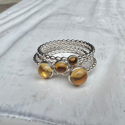 Different size Citrine Silver Rings stacked - Trisha Flanagan